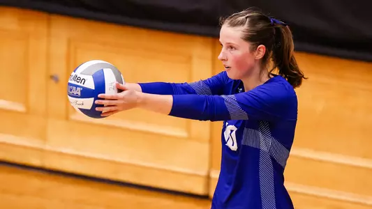 Jenna Walsh prepares to serve against Kent State on Sept. 8