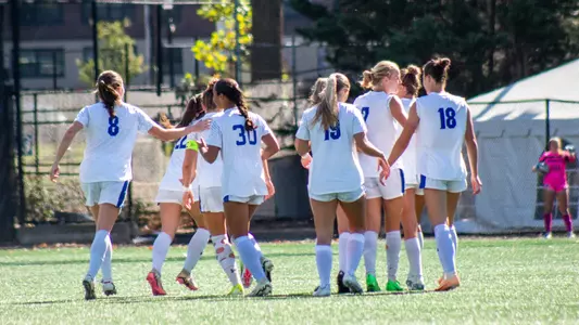 Pirates celebrate after scoring a goal against Providence