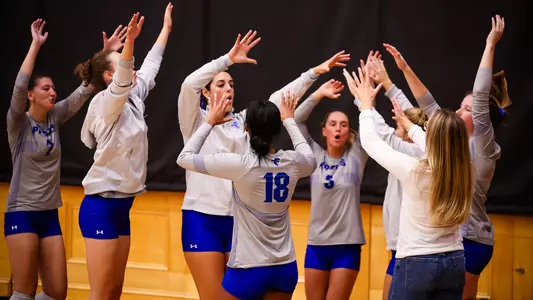 Seton Hall volleyball team bench celebrates after scoring a point against Georgetown on Oct. 16