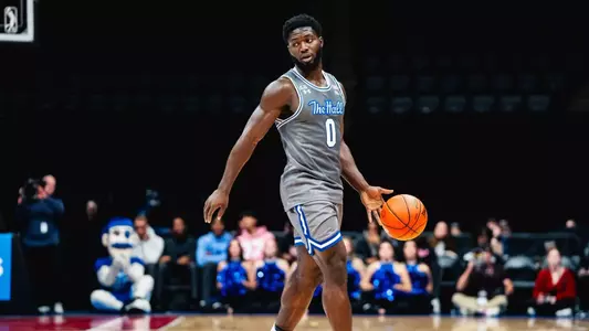 Dylan Addae-Wusu dribbles the ball against Hofstra at Nassau Coliseum