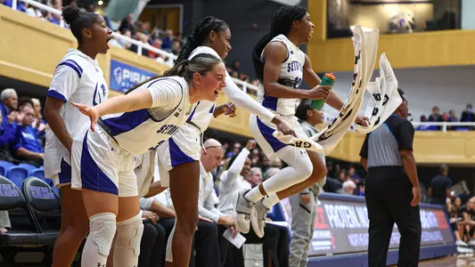 Seton Hall WBB team celebrates a teammates' basket against Bryant on Nov. 16