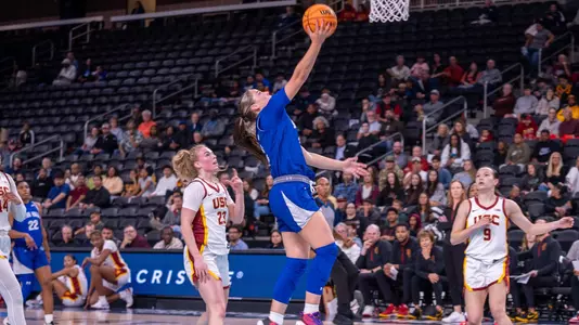 Faith Masonius drives to the hoop against USC on Nov. 27