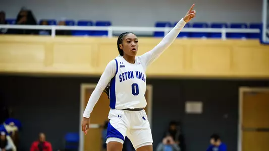 Jada Eads reacts after hitting a three-pointer.