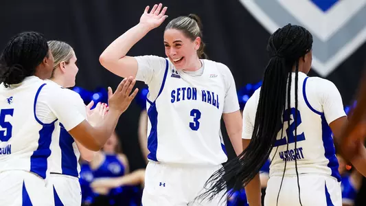 Faith Masonius celebrates with her teammates during Seton Hall's game against Bryant on Nov. 16