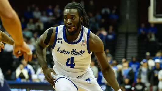 Prince Aligbe drives to the basket against Monmouth
