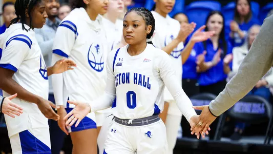 Jada Eads high-fives her teammates during pregame introductions