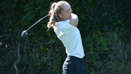 Anne-Sofie Ekman takes a practice swing during  around in the fall of 2023