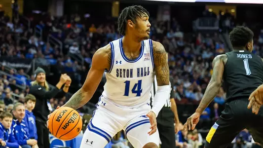 Dre Davis surveys the floor against Marquette at Prudential Center