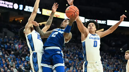 Feb 28, 2024; Omaha, Nebraska, USA; Seton Hall Pirates guard Al-Amir Dawes (2) shoots over Creighton Bluejays forward Jasen Green (0) and guard Trey Alexander (23) in the first half at CHI Health Center Omaha. Mandatory Credit: Steven Branscombe-USA TODAY Sports