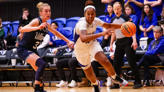 Azana Baines drives past Lucy Olsen against Villanova on Jan. 3