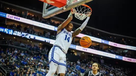 Dre Davis finishes a dunk against Providence at Prudential Center