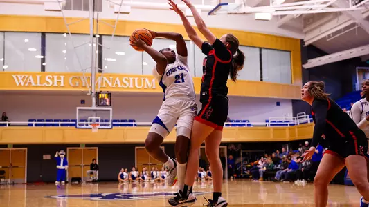 Shailyn Pinkney bends for a shot against Princeton on Nov. 29