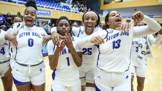 WBB players celebrate after a victory during the non-conference in 2023