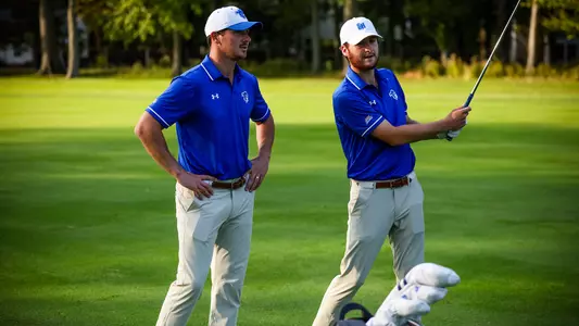 Head Coach JT Harper and George Fricker chat during a practice round in the fall of 2023