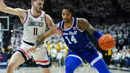 Dre Davis drives to the basket at UConn