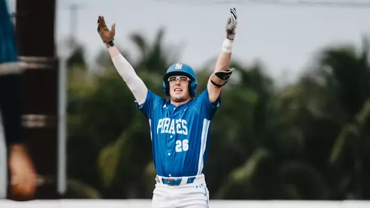 Kyle Lyons celebrates a base hit at FIU