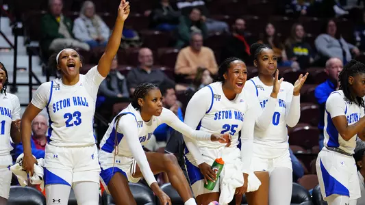 Seton Hall players on the bench celebrate during Seton Hall's win over DePaul on March 8