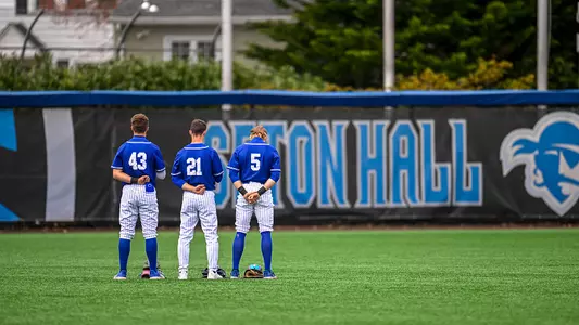 The Seton Hall outfield stands for the National Anthem before a game against Villanova