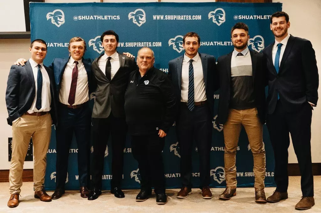 Michael Cocco with Seotn Hall baseball players at the 2024 First Pitch Dinner.