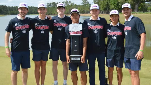 Photo of the starting five Seton Hall men's golfers and their coaches who one the 2024 BIG EAST Championship.
