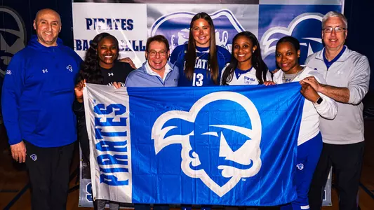 Faith Masonius poses with the Seton Hall women's basketball coaching staff during her official recruiting visit.