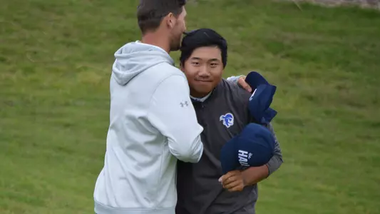 Wenliang Xie hugs his head coach JT Harper after the final round of the 2024 NCAA Rancho Santa Fe Regional on May 15.