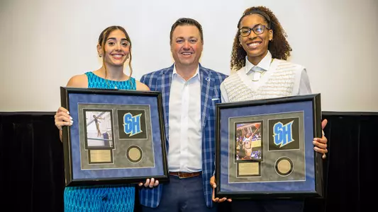 Photo of Silvia Alessio, Bryan Felt and Azana Baines. Alessio and Baines were named Seton Hall Senior Female Athletes of the Year.