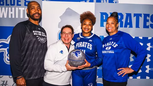 A graphic showing new Seton Hall recruit Kaydan Lawson, her family and Seton Hall head coach Tony Bozzella.