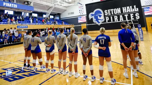 The Seton Hall women's volleyball team lines up for the National Anthem prior to a game during the 2023 season.