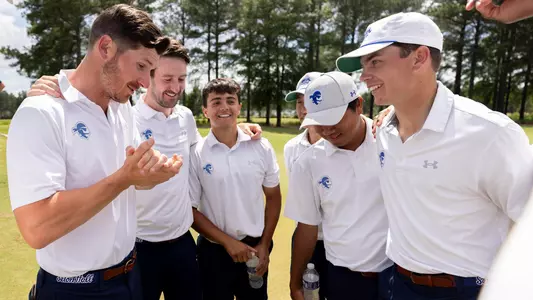 Seton Hall men's golf head coach JT Harper address the team after winning the BIG EAST title on April 29