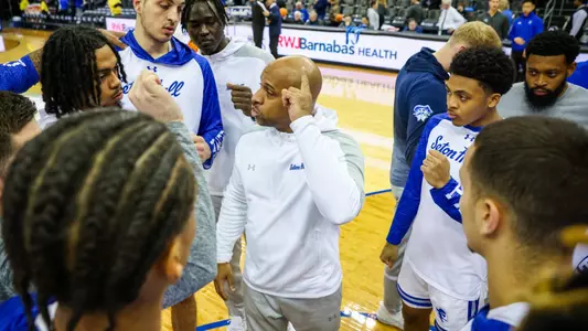 Assistant coach Corey Lowery talks to the Seton Hall men's basketball team before a game at Prudential Center