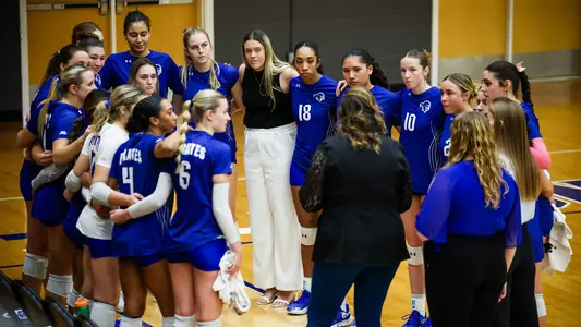 The Seton Hall volleyball team huddles prior to its match against Creighton on Senior Day during the 2023 season.