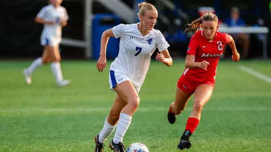 Phoebe Hampson dribbles the ball against Marist at Owen T. Carroll Field