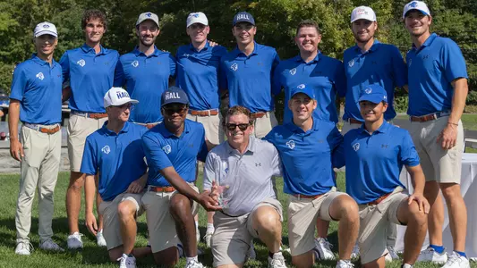 The Seton Hall men's golf team poses with the trophy after winning the Alex Lagowitz Memorial on Sept. 1.