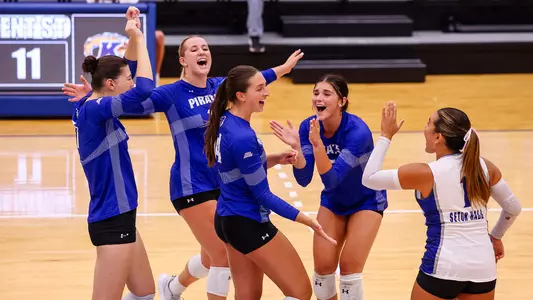 The Seton Hall volleyball team celebrates after scoring a point against Kent State on Sept. 8.