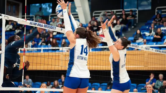 Reagan Merk and Asli Subasili go for a block against Villanova on Sept. 28