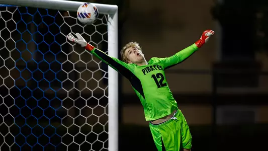 Soren Jensen skies to make a save against Manhattan.