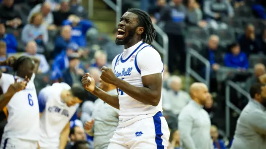Prince Aligbe celebrates a defensive stop against DePaul