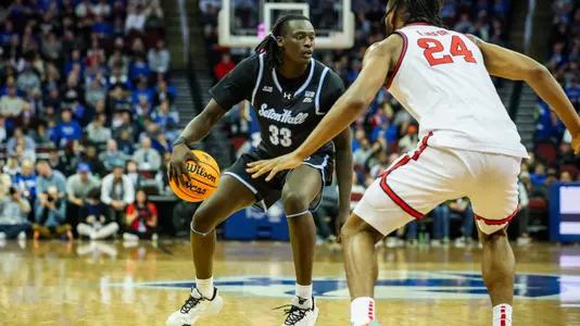 Garwey Dual dribbles the ball against St. John's