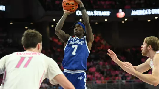 Jan 25, 2025; Omaha, Nebraska, USA;  Seton Hall Pirates forward Scotty Middleton (7) scores against Creighton Bluejays center Ryan Kalkbrenner (11) and forward Isaac Traudt (41) during the first half at CHI Health Center Omaha. Mandatory Credit: Steven Branscombe-Imagn Images