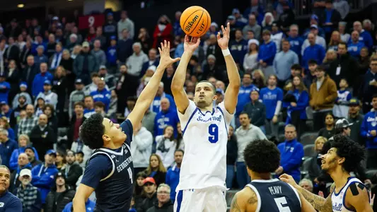 Yacine Toumi takes a three-pointer against Georgetown