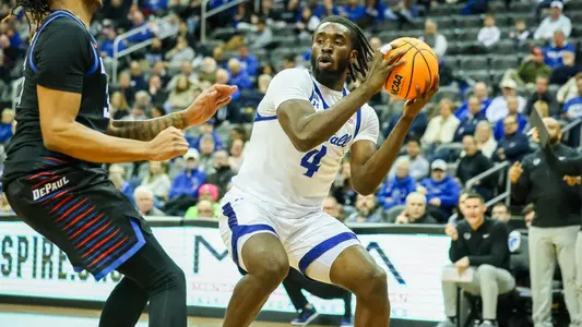 Prince Aligbe takes a shot against DePaul
