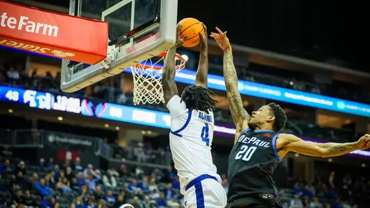 Prince Aligbe goes up for a dunk against DePaul