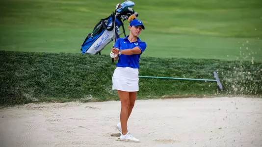 Marta Aguilar hits from the bunker during a practice round in the fall of 2025