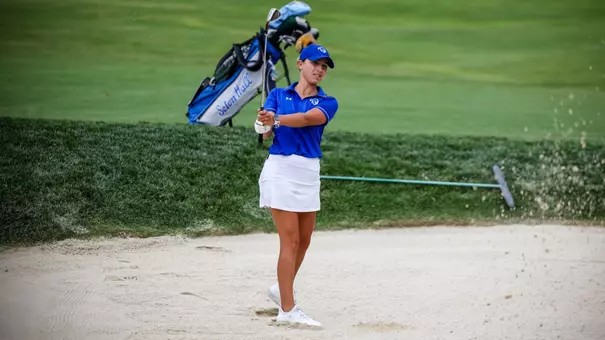 Marta Aguilar hits from the bunker during a practice round in the fall of 2025