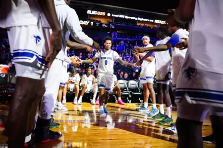 Budd Clark Walking Through Handshake Line During Pregame Introductions vs Saint Peter's
