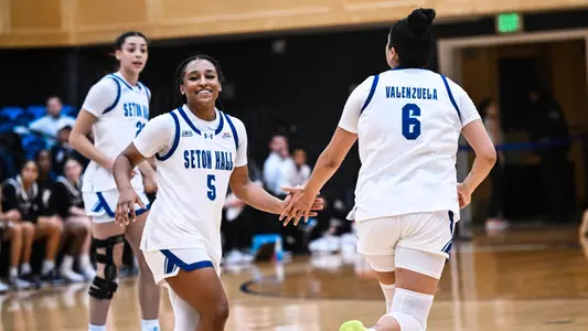 Savannah Catalon and Mariana Valenzuela exchange a high five during Seton Hall's game against Xavier on Dec. 28