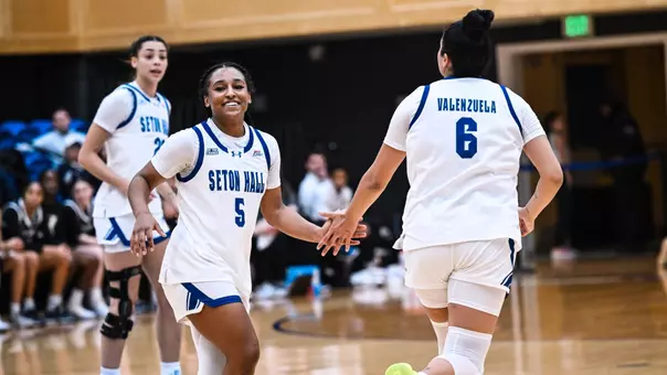 Savannah Catalon and Mariana Valenzuela exchange a high five during Seton Hall's game against Xavier on Dec. 28