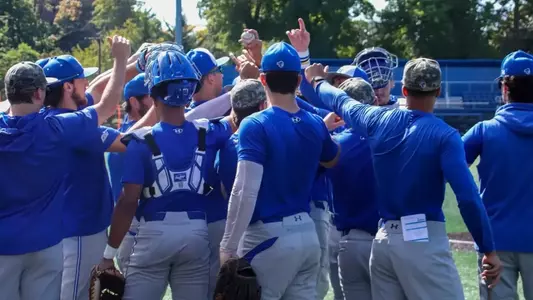 Seton Hall baseball huddles before an instrasquad scrimmage