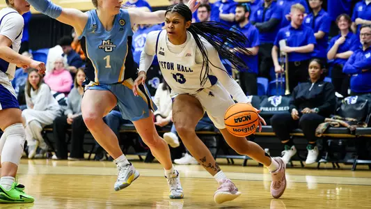 Messiah Hunter drives past a defender against Marquette on Feb. 12